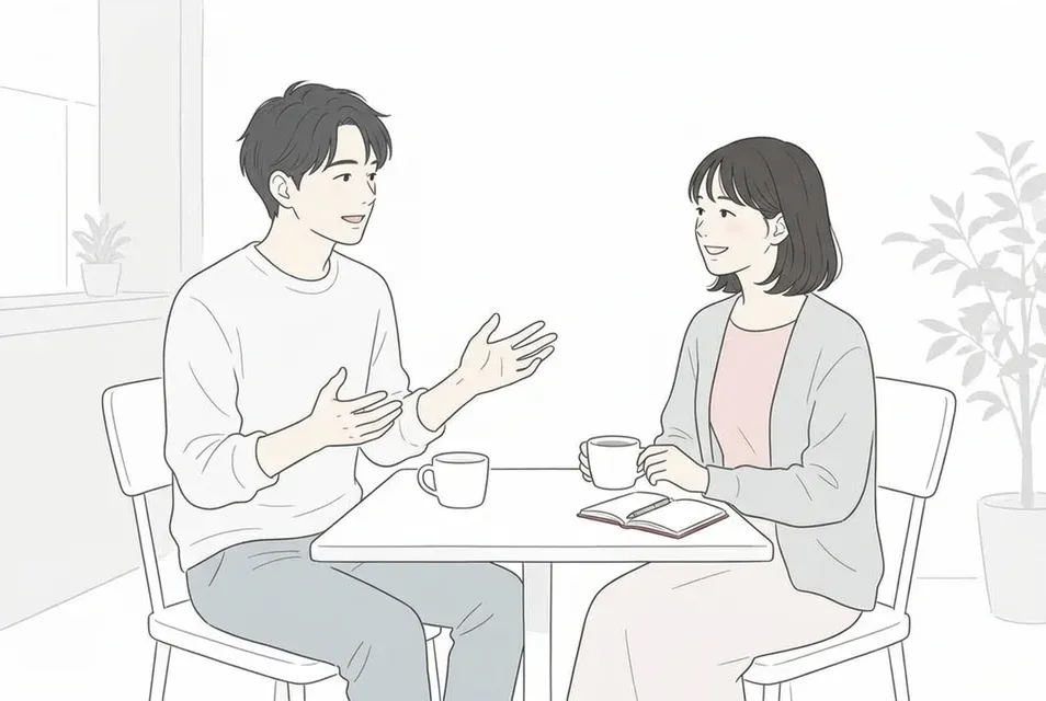 落ち着いたカフェで、身振りを交えて話す男性に興味深そうに微笑みながら耳を傾ける女性