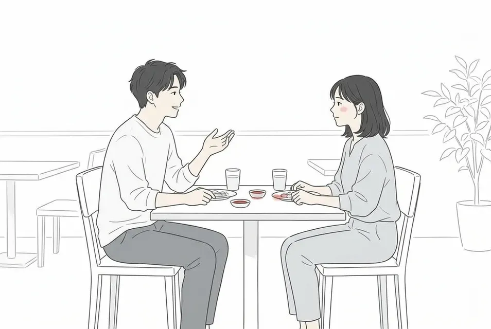 落ち着いたレストランで向かい合い、相手の表情や食事の所作を確かめながら会話する男女